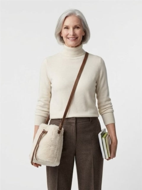 Sheepskin bucket bag with eyelets and leather draw string