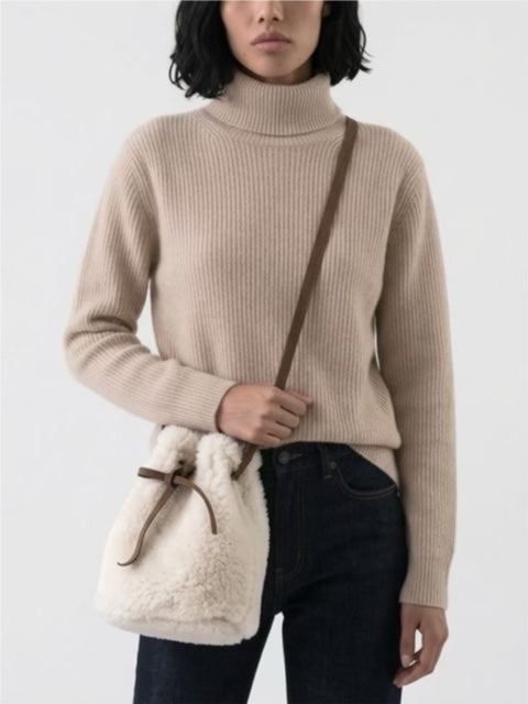 Sheepskin bucket bag with eyelets and leather draw string