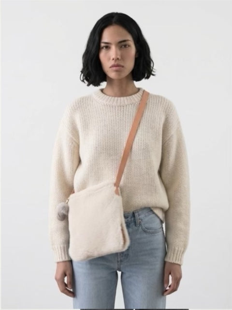 Sheepskin cross body bag with zip and sheepskin mitt tag